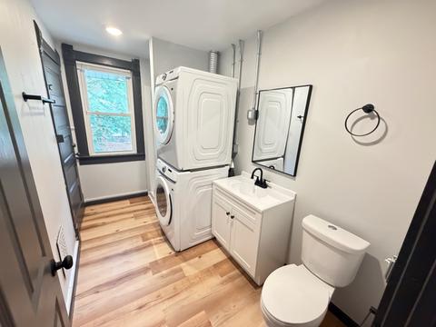 Renovated bath with stacked laundry